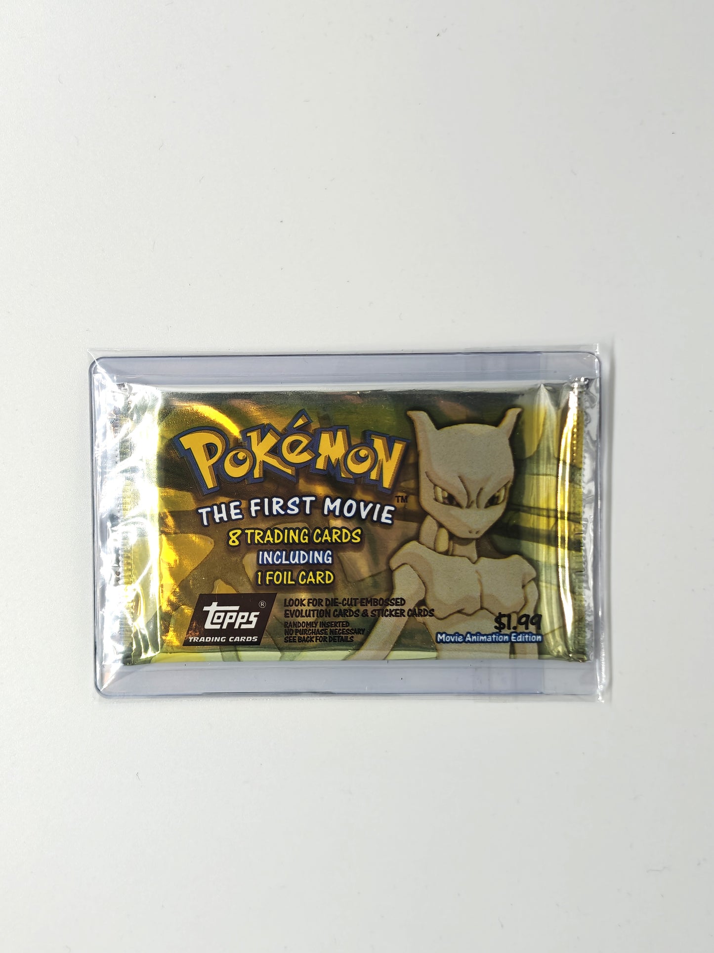 Pokemon - Topps The First Movie Booster Pack Gull Versjon (Silver Foil) Tamper Sealed.